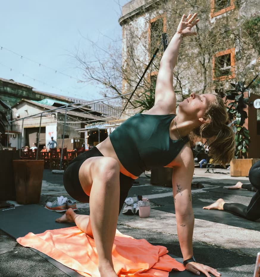 Woman stretching outdoors during an outdoor workout